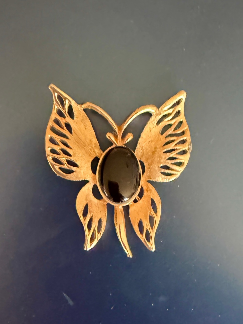 Art Noveau Gold Butterfly Brooch with Black Polished Oval Stone